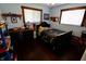 Stylish bedroom with dark wood floors, ample storage, and a bed with a decorative blanket at 3942 Senour Rd, Indianapolis, IN 46239