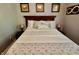 Bedroom with a dark wood bed frame, and matching side tables at 3942 Senour Rd, Indianapolis, IN 46239