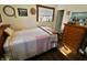 Comfortable bedroom featuring a beautiful wood bed frame, natural light, and tasteful decor at 3942 Senour Rd, Indianapolis, IN 46239