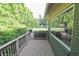 Charming deck featuring a large window, potted plants, and a peaceful view at 3942 Senour Rd, Indianapolis, IN 46239