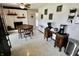 Eat-in kitchen featuring a wooden dining table, brick fireplace, and a coffee bar station at 3942 Senour Rd, Indianapolis, IN 46239