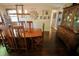 Formal dining room featuring a stylish wooden table with seating for six and an antique hutch at 3942 Senour Rd, Indianapolis, IN 46239