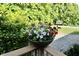 Beautiful floral arrangement on the deck with a lovely garden view at 3942 Senour Rd, Indianapolis, IN 46239