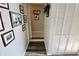 Hallway showcasing wood floors, closet, and decorative framed pictures at 3942 Senour Rd, Indianapolis, IN 46239