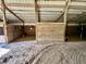 Equestrian barn featuring horse stalls with classic wood doors and ample space for equestrian activities at 3942 Senour Rd, Indianapolis, IN 46239