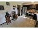 Charming kitchen featuring dark cabinetry and stainless steel appliances, complemented by white countertops at 3942 Senour Rd, Indianapolis, IN 46239