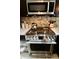 A stainless steel gas range with an oven adds a modern touch to the kitchen, perfect for cooking enthusiasts at 3942 Senour Rd, Indianapolis, IN 46239