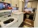 Laundry room showcasing a washer and dryer with cabinets and a wooden countertop at 3942 Senour Rd, Indianapolis, IN 46239