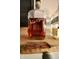Elmer T. Lee Kentucky Straight Bourbon Whiskey bottle on a wooden shelf at 3942 Senour Rd, Indianapolis, IN 46239