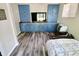Living room featuring a built-in blue wall unit and wooden countertops at 3942 Senour Rd, Indianapolis, IN 46239