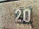 Close-up of a wooden sign displaying the number '20' at 3942 Senour Rd, Indianapolis, IN 46239