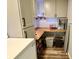 Pantry featuring wooden countertops, storage cabinets, and decorative items at 3942 Senour Rd, Indianapolis, IN 46239