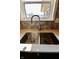 Double stainless steel sink with gooseneck faucet and white countertop at 3942 Senour Rd, Indianapolis, IN 46239