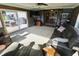 Bright sunroom with carpet and lots of windows overlooking the yard and open to dining area at 3942 Senour Rd, Indianapolis, IN 46239