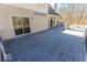 A backyard showing a wooden deck with access to the pool and the house's exterior at 3948 S Woodfield Dr, New Palestine, IN 46163