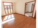 Sun-drenched dining room featuring hardwood floors and large windows offering a view of the outdoors at 3948 S Woodfield Dr, New Palestine, IN 46163