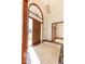 Inviting foyer with tile flooring, wood trim, and a front door featuring decorative glass at 3948 S Woodfield Dr, New Palestine, IN 46163