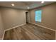Bedroom featuring hardwood floors, neutral paint, a ceiling fan, and an abundance of natural light at 420 S Hamilton Ave, Indianapolis, IN 46201