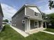 Charming two-story duplex with gray siding, white trim and inviting front porches at 420 S Hamilton Ave, Indianapolis, IN 46201