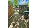 View of backyard showing a storage shed, wooden fence and trash container at 4235 Foxglove Trce, Indianapolis, IN 46237