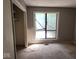 Bedroom with a large window, closet and gray walls at 4235 Foxglove Trce, Indianapolis, IN 46237