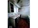 Galley kitchen with basic cabinetry, double basin sink and a window at 4235 Foxglove Trce, Indianapolis, IN 46237