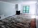 Spacious living room with fireplace and large window, ready for renovation at 4235 Foxglove Trce, Indianapolis, IN 46237