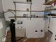 Utility storage features mounted shelving and a water filtration system at 4235 Foxglove Trce, Indianapolis, IN 46237