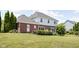 A spacious, grassy backyard, featuring a nice deck area, perfect for relaxation at 4415 Summer Dr, Zionsville, IN 46077