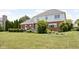 Spacious backyard featuring a well-maintained lawn, mature landscaping and a deck at 4415 Summer Dr, Zionsville, IN 46077