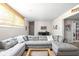 Relaxing basement living area with a large gray sectional sofa and cozy decor at 4415 Summer Dr, Zionsville, IN 46077