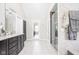 Bathroom featuring a double vanity, shower, and plenty of natural light at 4415 Summer Dr, Zionsville, IN 46077