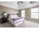 A cozy bedroom with natural light, plush bedding, and a vaulted ceiling at 4415 Summer Dr, Zionsville, IN 46077