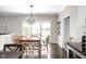 Charming dining area with chandelier lighting and views of the backyard and outdoor area at 4415 Summer Dr, Zionsville, IN 46077