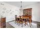 Elegant dining room featuring a crystal chandelier, hardwood floors, and ornate details at 4415 Summer Dr, Zionsville, IN 46077