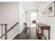 View of a hallway with hardwood floors, a console table, and framed pictures on the wall at 4415 Summer Dr, Zionsville, IN 46077