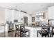 Modern kitchen with white cabinets, black countertops, and stainless steel appliances at 4415 Summer Dr, Zionsville, IN 46077