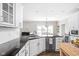 Bright kitchen with granite countertops, white cabinets, and stainless steel appliances at 4415 Summer Dr, Zionsville, IN 46077