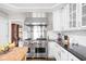 Gourmet kitchen featuring a professional-grade range and custom cabinetry at 4415 Summer Dr, Zionsville, IN 46077