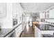 Spacious kitchen with white cabinets, large island, and stainless steel appliances at 4415 Summer Dr, Zionsville, IN 46077