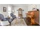 Elegant living room with a piano, display cabinet, and comfortable seating area at 4415 Summer Dr, Zionsville, IN 46077