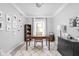 Cozy home office with neutral colors and a variety of personal photographs on display at 4415 Summer Dr, Zionsville, IN 46077