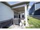 Outdoor covered patio with furniture, a grill, and a view of the backyard at 485 Washington St, Fortville, IN 46040