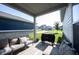 Relaxing back porch with outdoor seating and a grill at 485 Washington St, Fortville, IN 46040