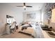 Bedroom decorated with ceiling fan, decorative pictures, and ample natural light at 485 Washington St, Fortville, IN 46040