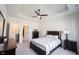 A calming bedroom featuring neutral tones, a ceiling fan, and storage furniture at 485 Washington St, Fortville, IN 46040