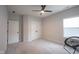 This bedroom offers a ceiling fan, natural light, and closet space at 485 Washington St, Fortville, IN 46040