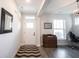 Inviting entryway with wood-look flooring, ample natural light, and a decorative rug at 485 Washington St, Fortville, IN 46040