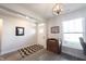 Inviting entryway featuring wood-look flooring, large windows, and stylish decor at 485 Washington St, Fortville, IN 46040
