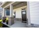 Inviting front porch with brick accents, stylish pillars, and a welcoming entrance at 485 Washington St, Fortville, IN 46040